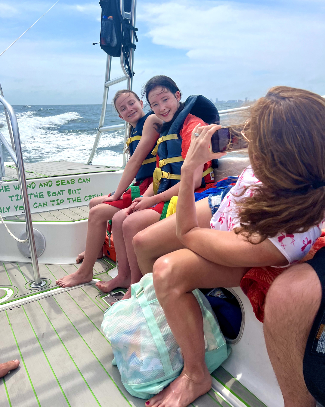 a group of people sitting on a boat