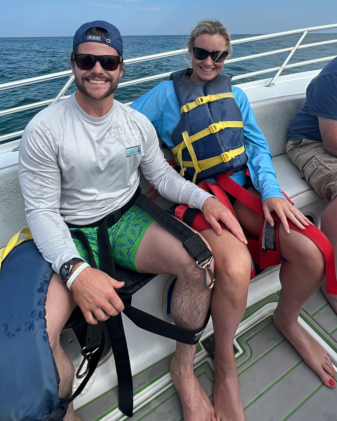 a group of people sitting at a dock